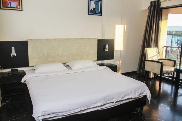 Hotel Aristro Lonavala Szoba fotó